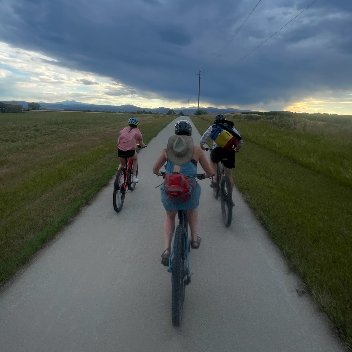 Family riding on bike path